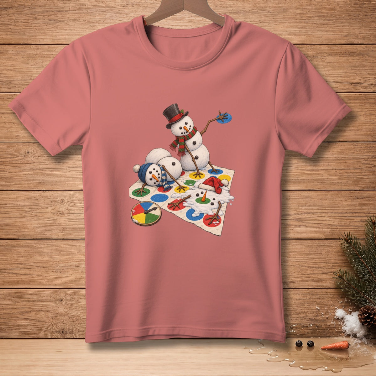 Snowmen playing a game of Twister on a pink t-shirt.