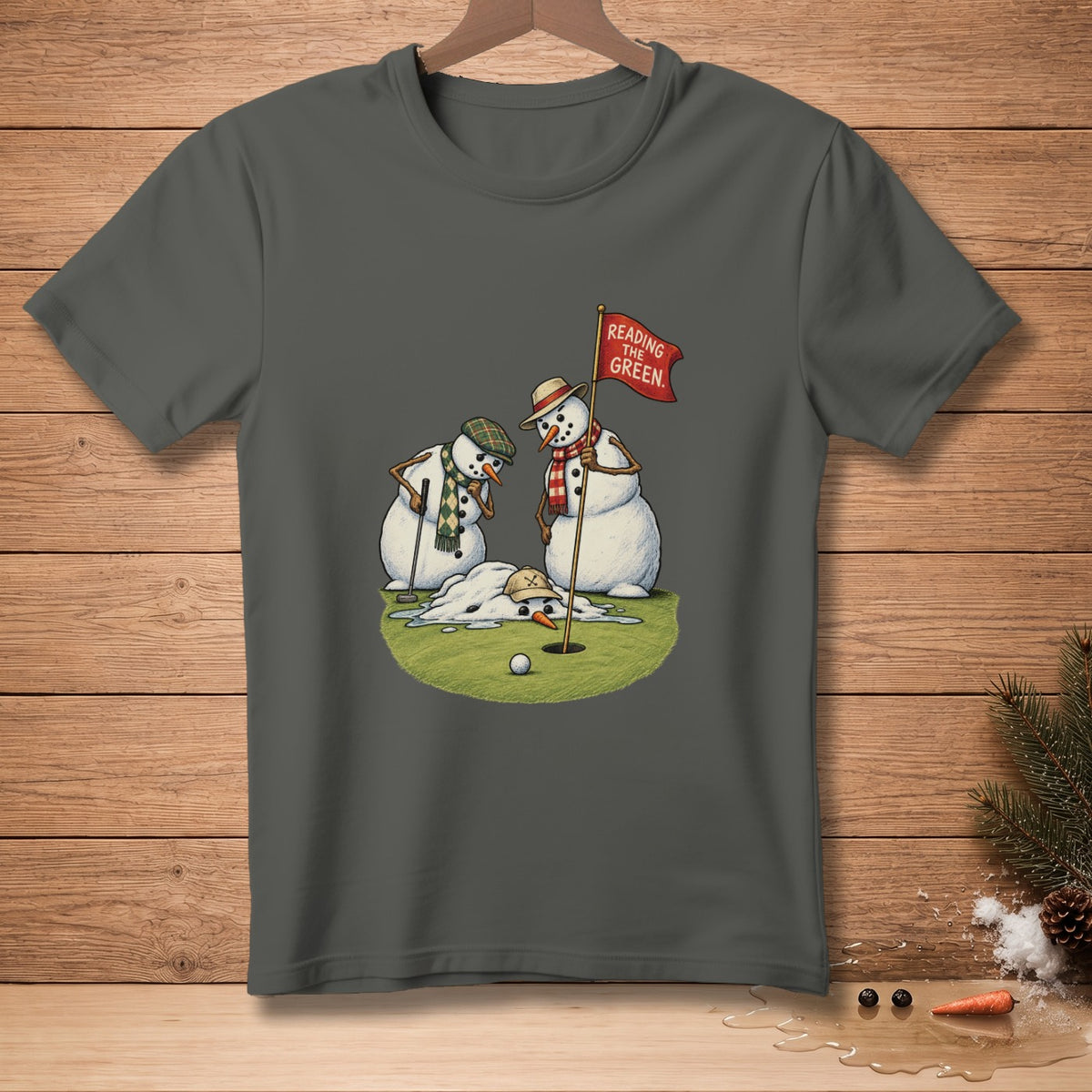 Snowmen on a golf course with a melting snowman and a flag reading "Reading The Green."