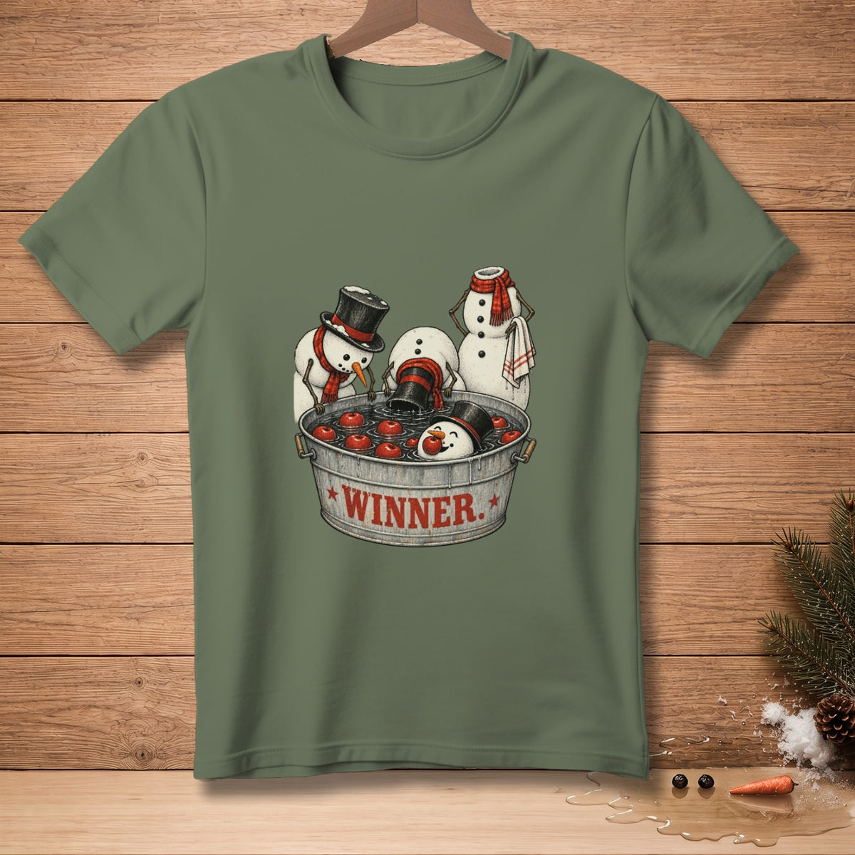 Snowmen playing bobbing for apples in a tub labeled "WINNER" with one snowman holding a towel.