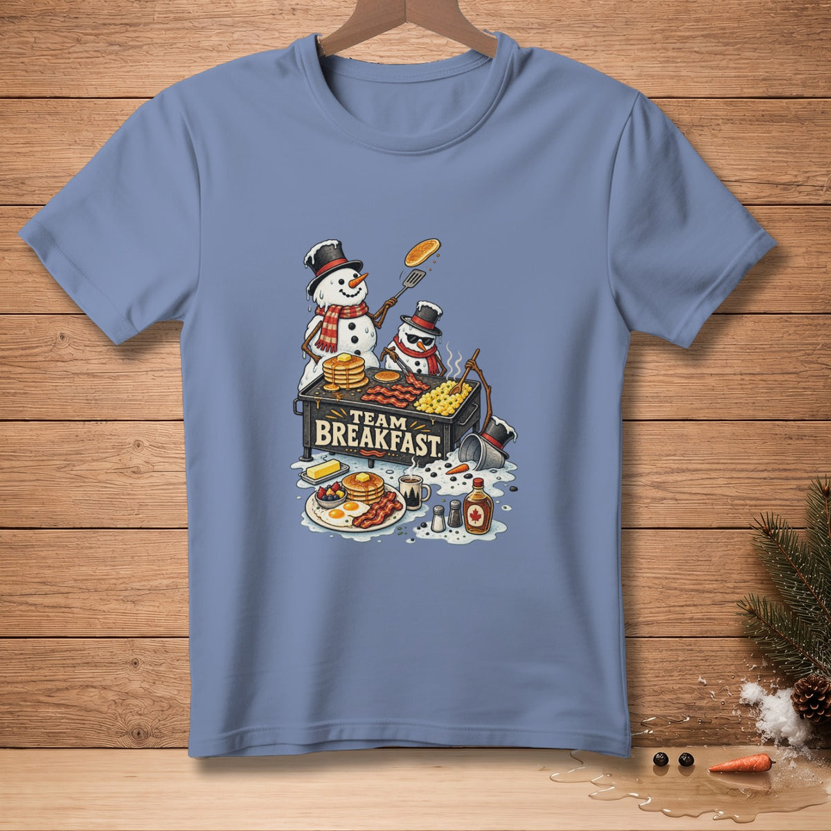 Two snowmen make breakfast on a grill with "Team Breakfast" text.