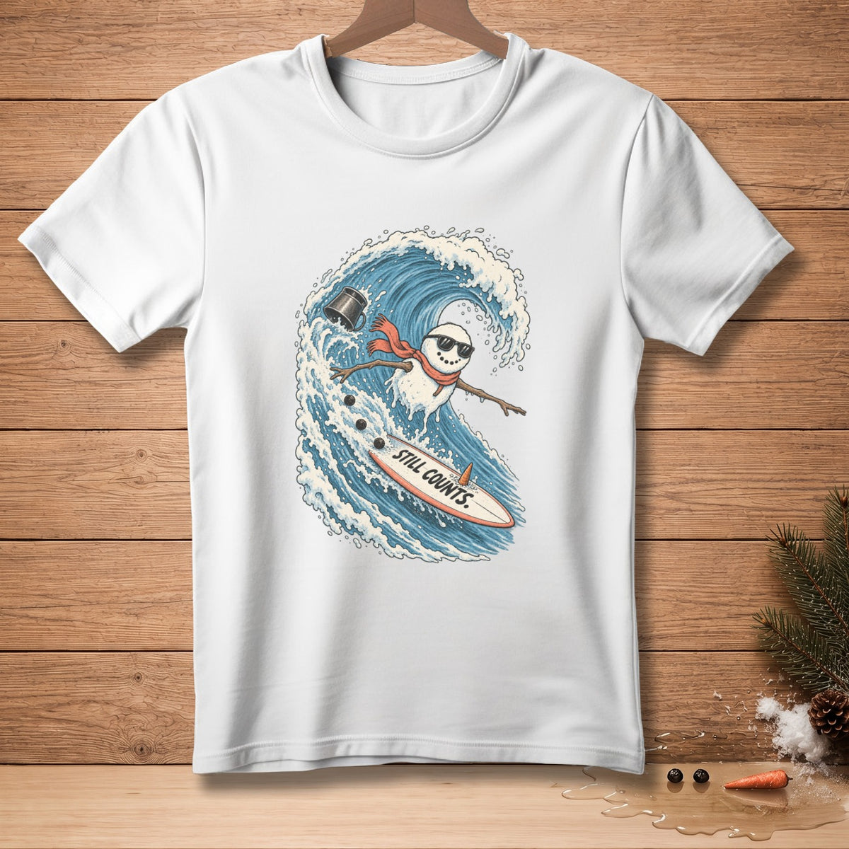 Snowman surfing a wave on a surfboard with text "STILL COUNTS."