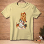 Snowman with a pancake tower, syrup, and text "Light Breakfast".