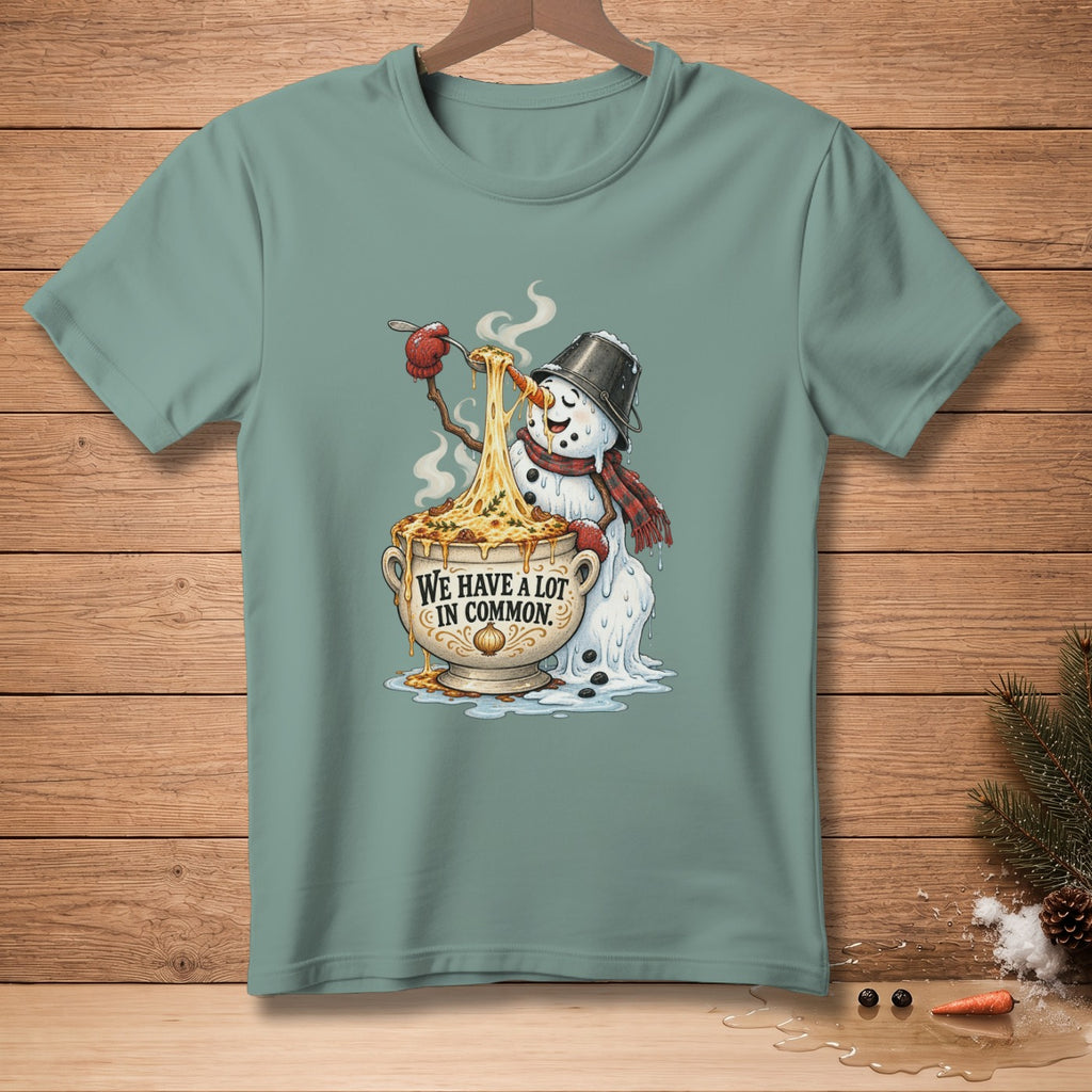 Snowman eating cheesy pasta from a bowl with text "We Have A Lot In Common".