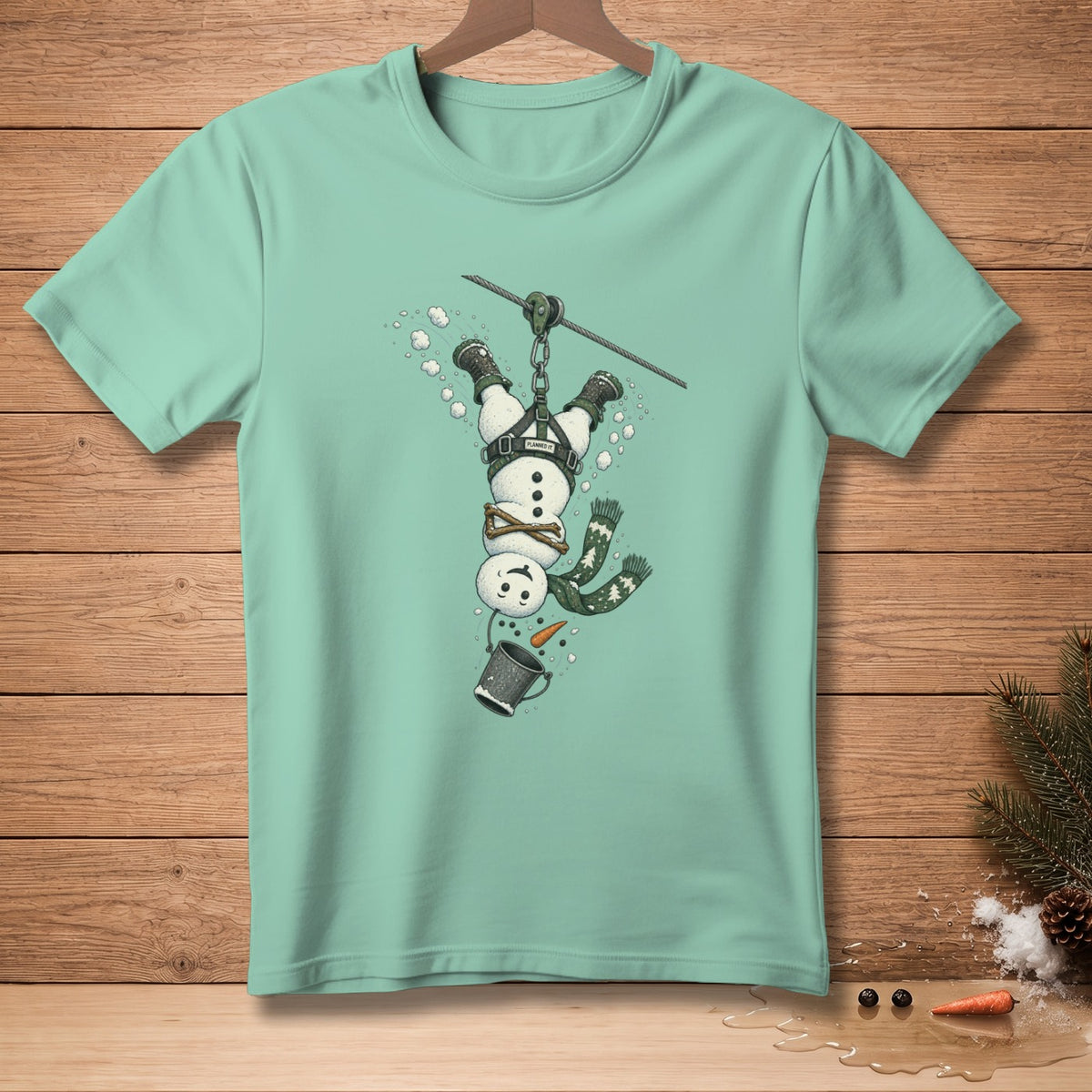 Snowman zip lining upside down with a bucket and carrot.