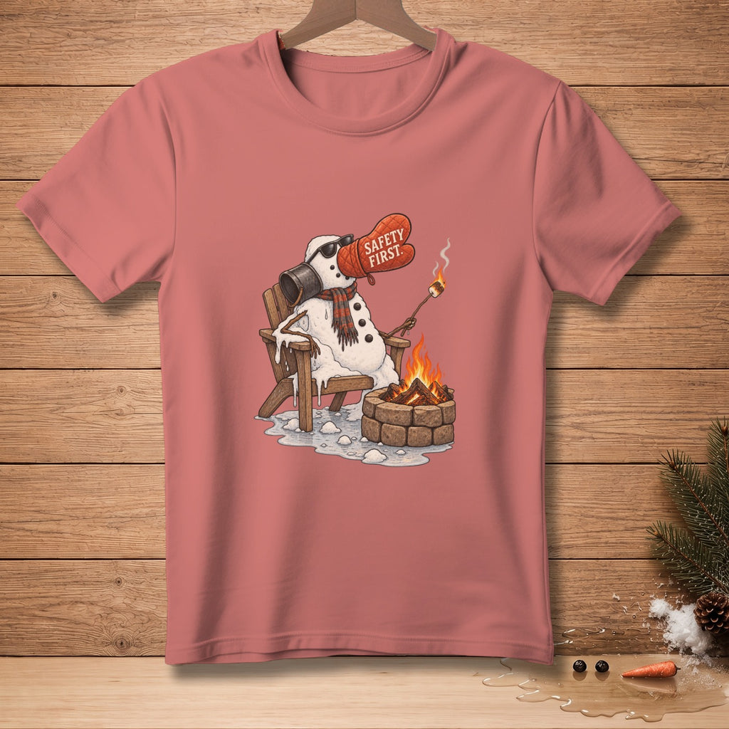 Melting snowman in chair roasting marshmallow by fire, with "Safety First" oven mitt.