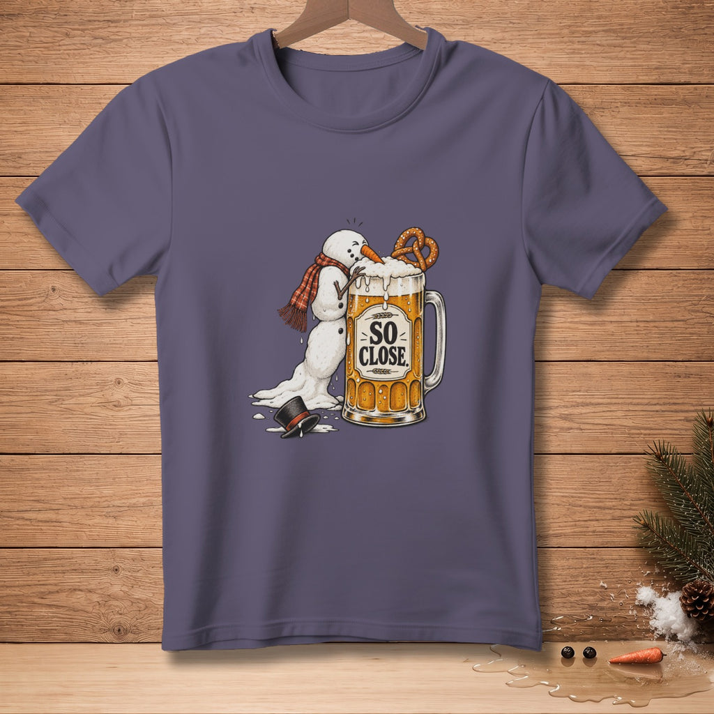 Snowman melting into beer mug with "So Close" text and pretzel.