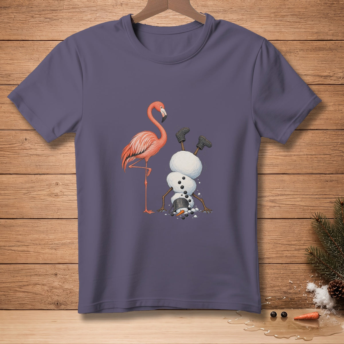 Flamingo and a snowman doing a handstand on a purple t-shirt.