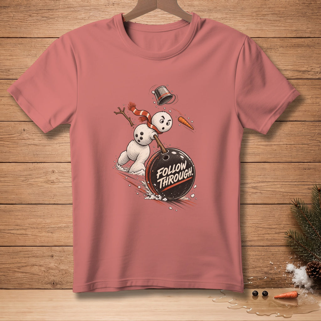 Snowman bowling with text "FOLLOW THROUGH" on a pink t-shirt.