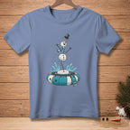 Blue t-shirt with a cartoon snowman falling into a striped inflatable tube.