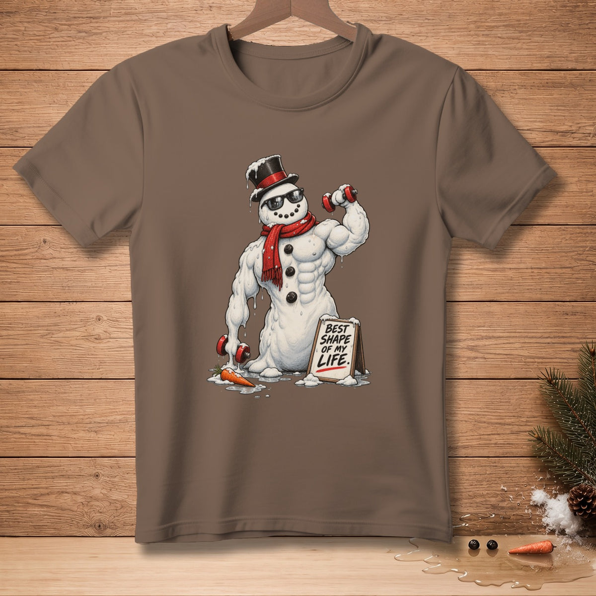 Muscular snowman in sunglasses and top hat lifts weights, holding sign saying "BEST SHAPE OF MY LIFE."