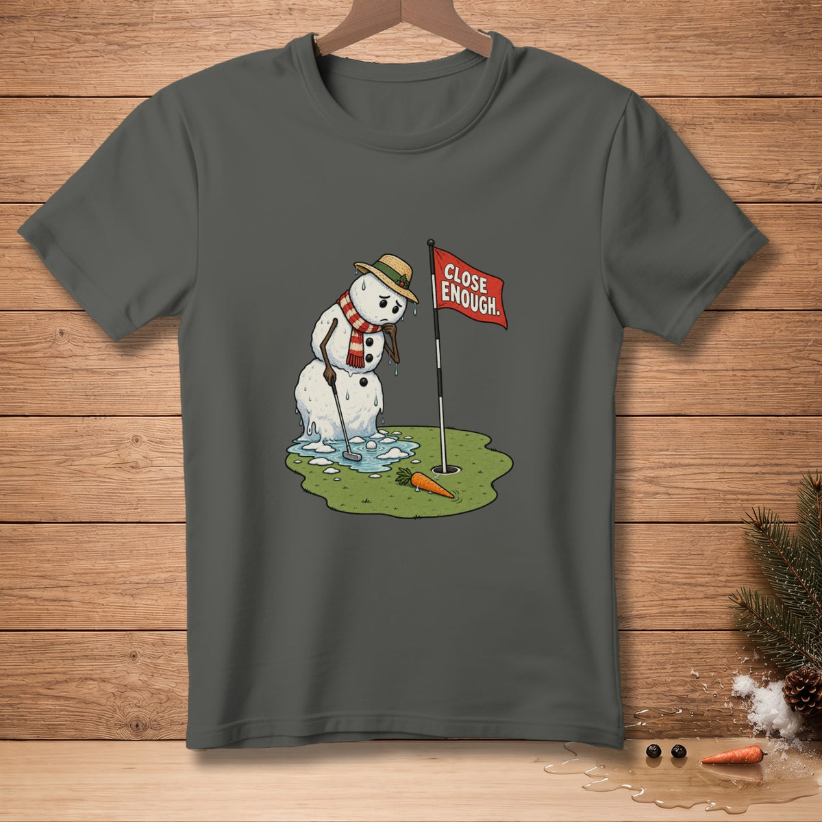 Melting snowman golfer at a hole with a "Close Enough" flag and a carrot.