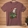 Snowman playing foosball with text "GET IN THE GAME" on a burgundy t-shirt.