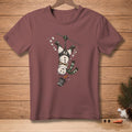 T-shirt graphic of snowman zip-lining upside down with a bucket of snow