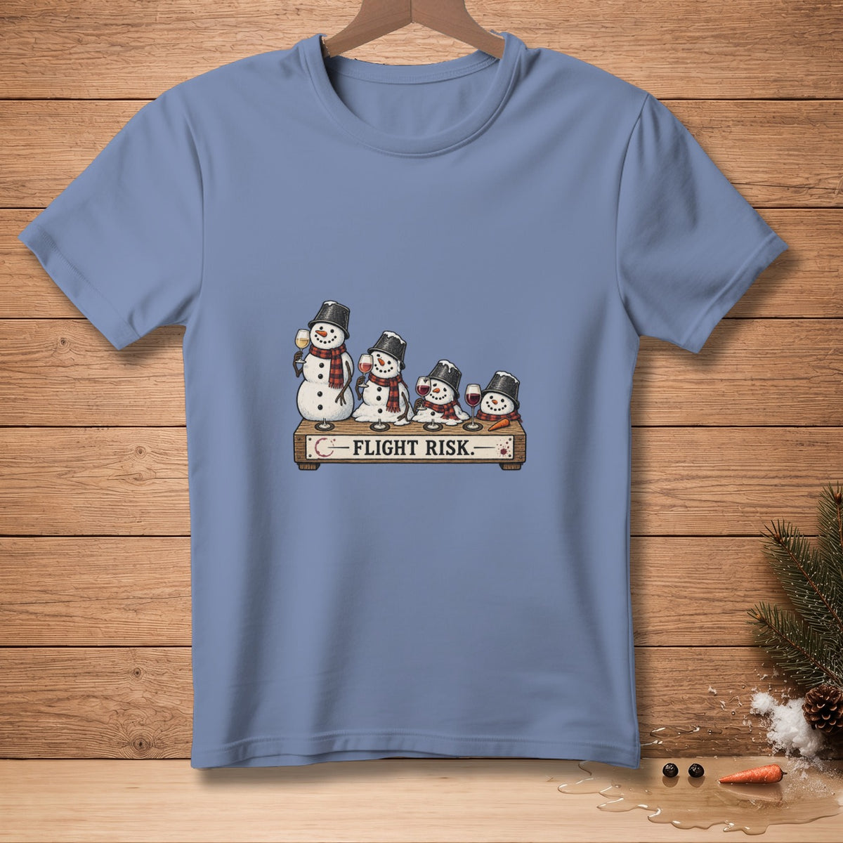 T-shirt graphic with snowmen holding wine glasses and the text "FLIGHT RISK."