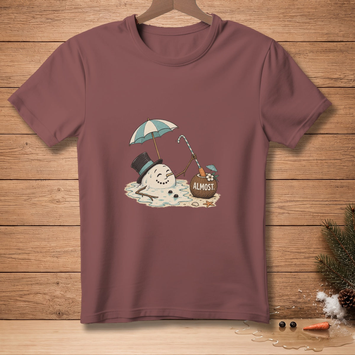 T-shirt with melting snowman under umbrella, holding candy cane, text "ALMOST".