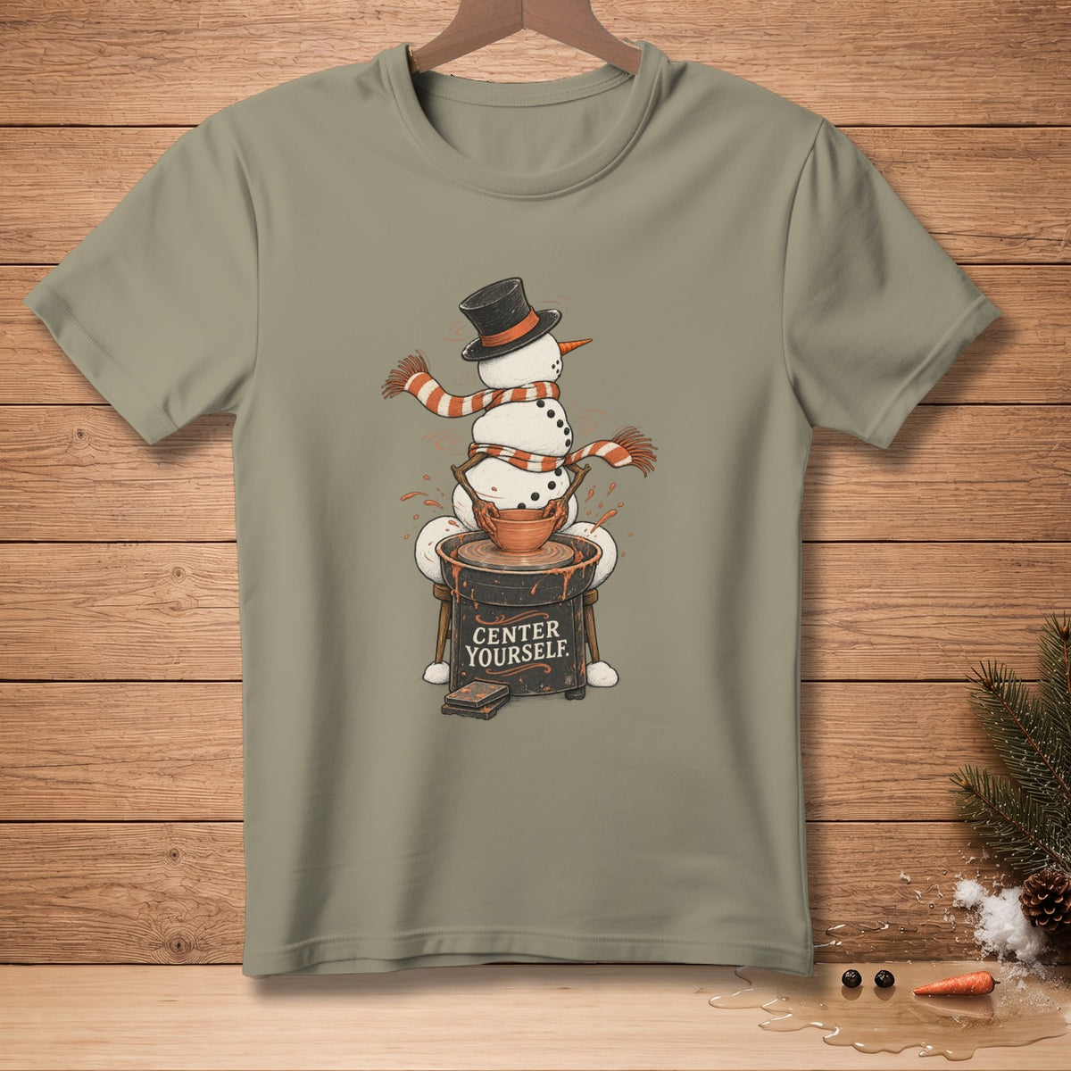 Snowman with hat and scarf at pottery wheel with text "CENTER YOURSELF."
