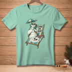 T-shirt graphic with snowmen melting on a beach chair with text "Save My Seat".