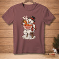 Melting snowman in hat and scarf eating soup with toast, text reads "COMFORT FOOD".