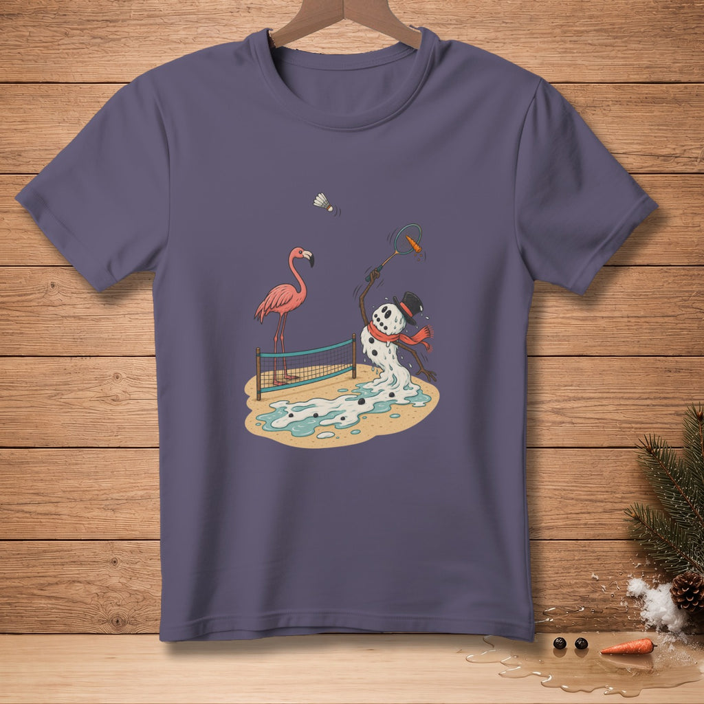 T-shirt with cartoon of melting snowman playing badminton with flamingo on beach.