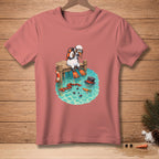 Snowman diver sits on a dock above water with a scarf, hat, and carrots.