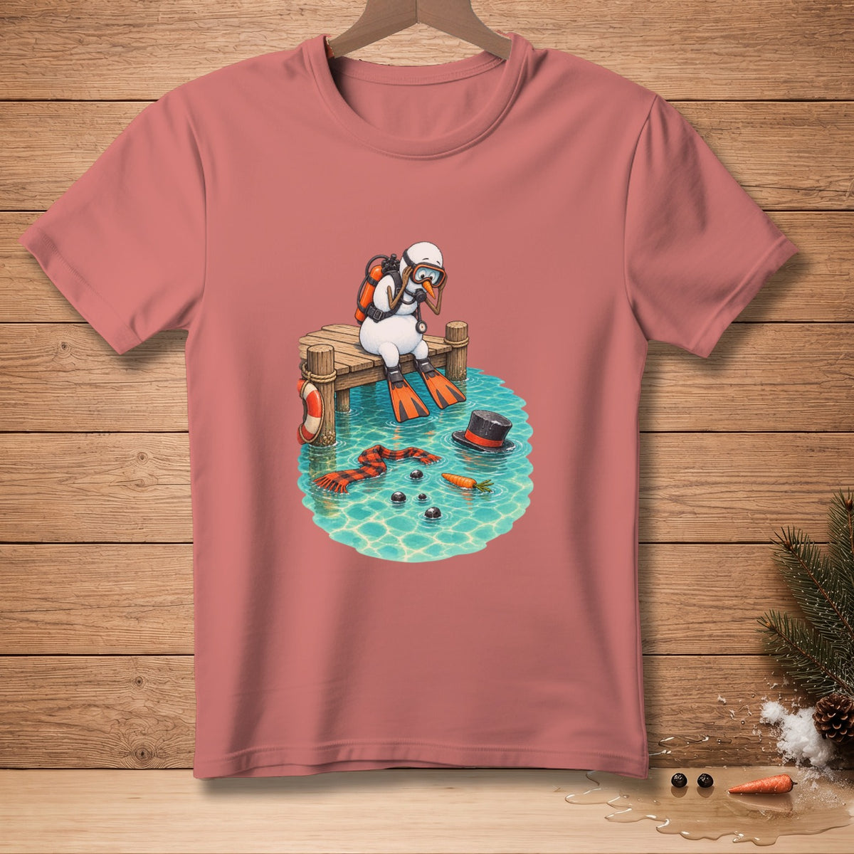 Snowman diver sits on a dock above water with a scarf, hat, and carrots.