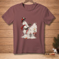 Snowman in firefighter helmet and scarf sprays snow from a red extinguisher onto a table.