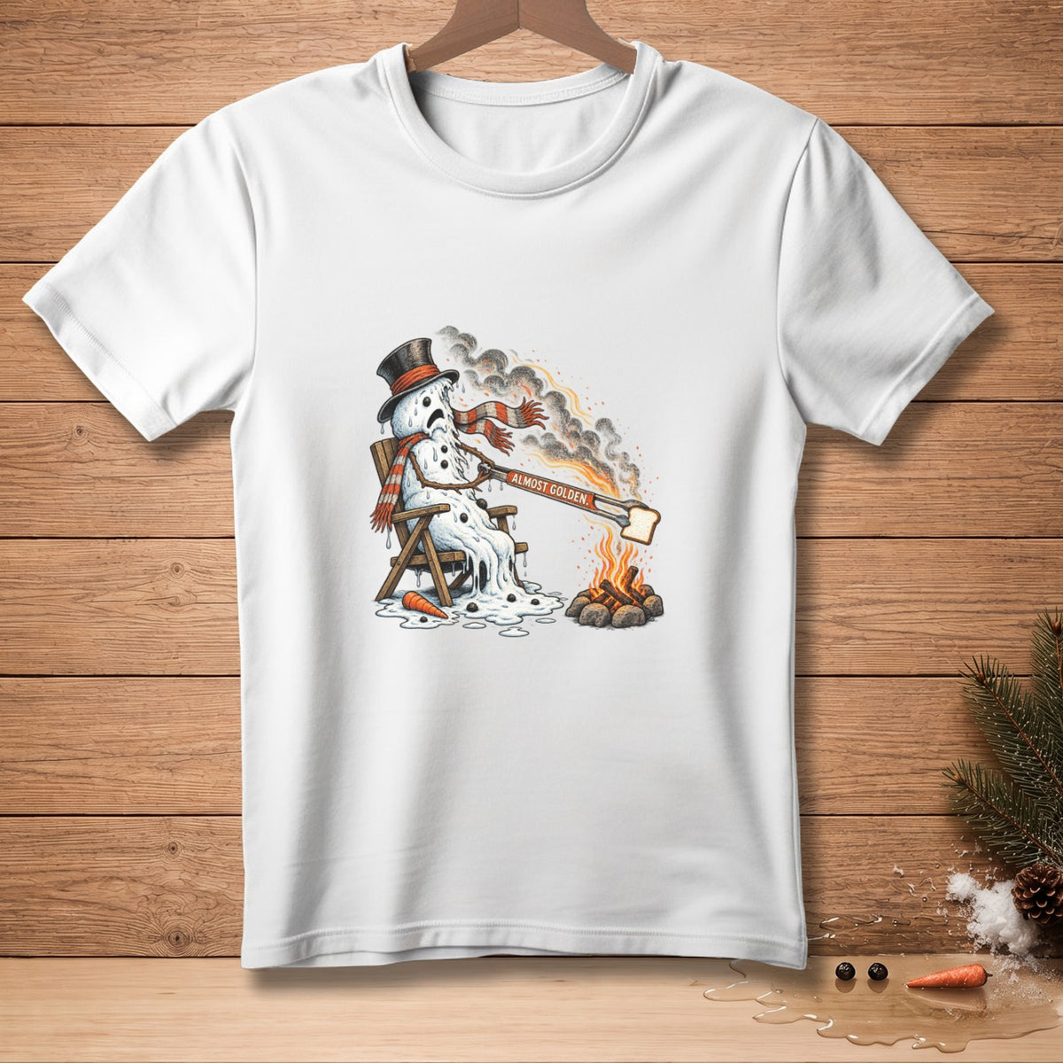 Melting snowman wearing a hat and scarf toasting bread, "ALMOST GOLDEN".