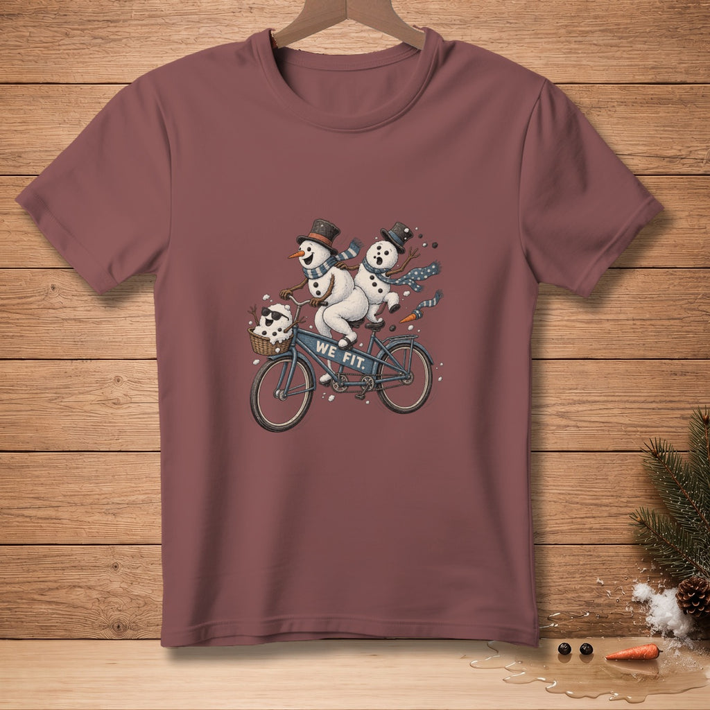 Two snowmen in hats and scarves ride a tandem bicycle with "WE FIT." text.