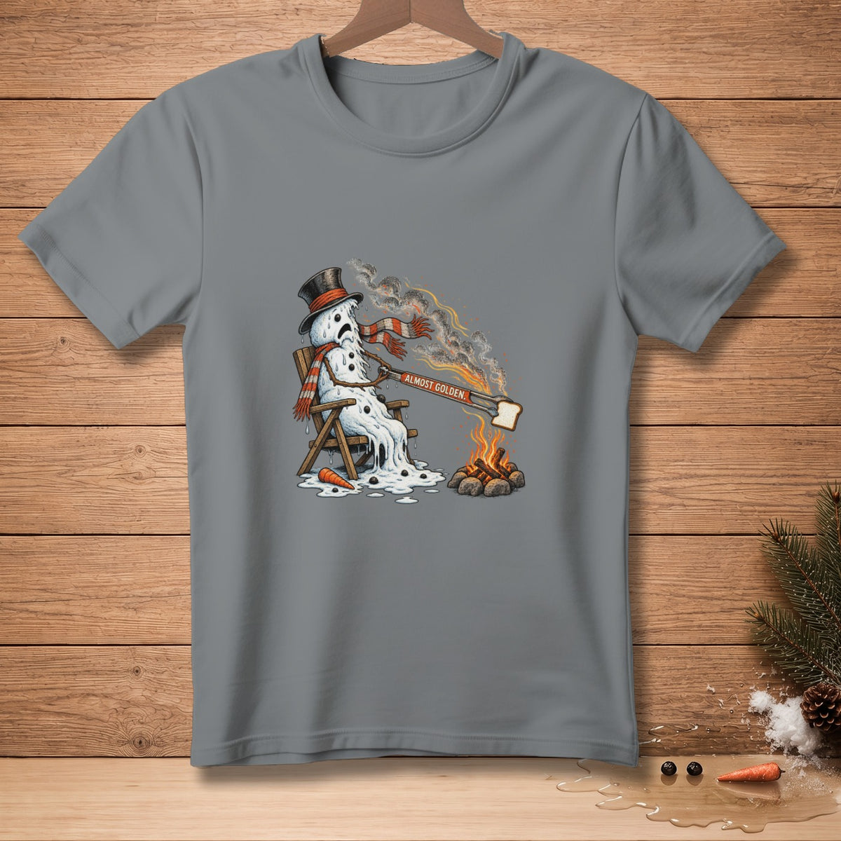 Melting snowman with toast over a campfire reads "Almost Golden."