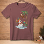 Snowman holding cocktails with monkey by palm tree on maroon t-shirt.