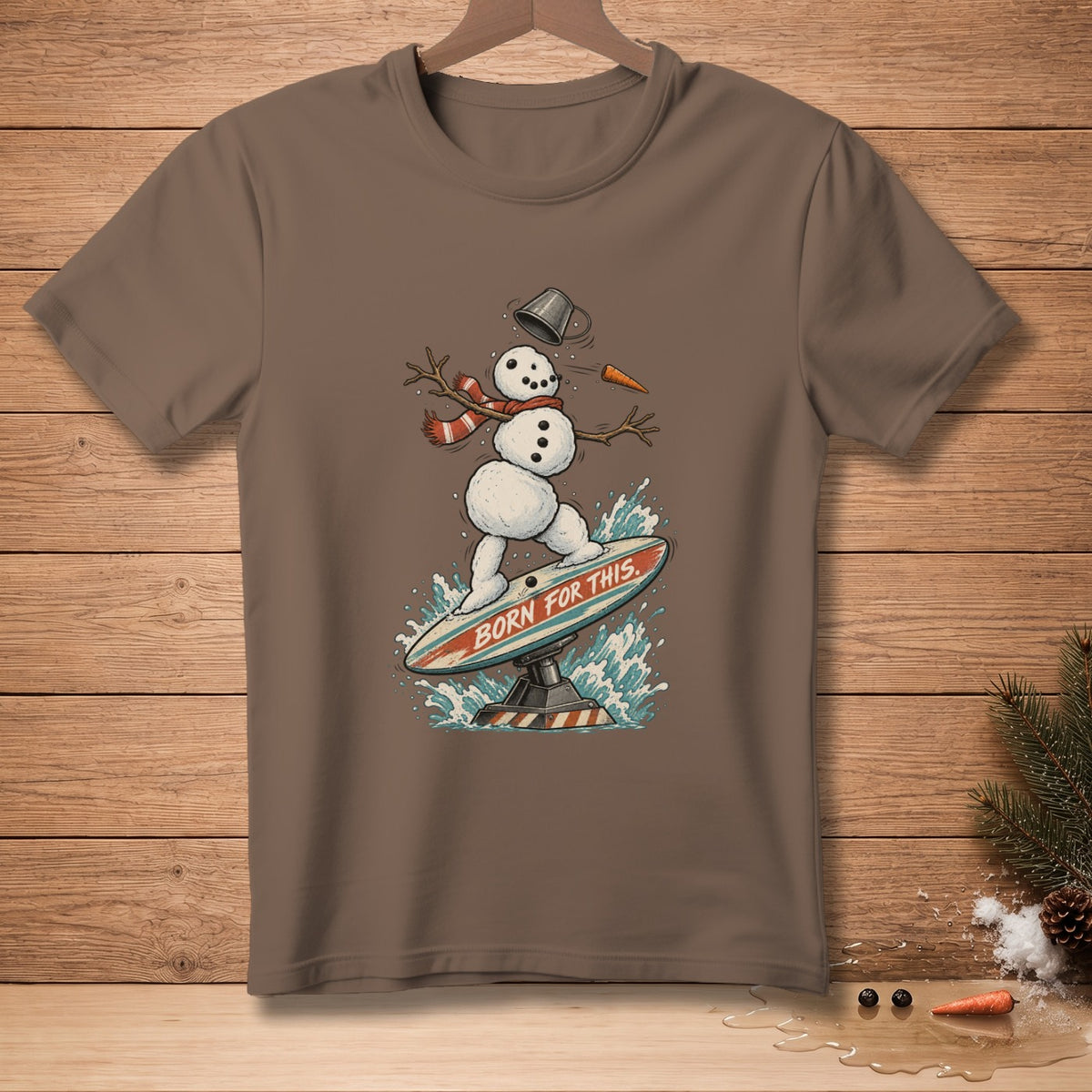 Snowman surfing on a surfboard with text "BORN FOR THIS."