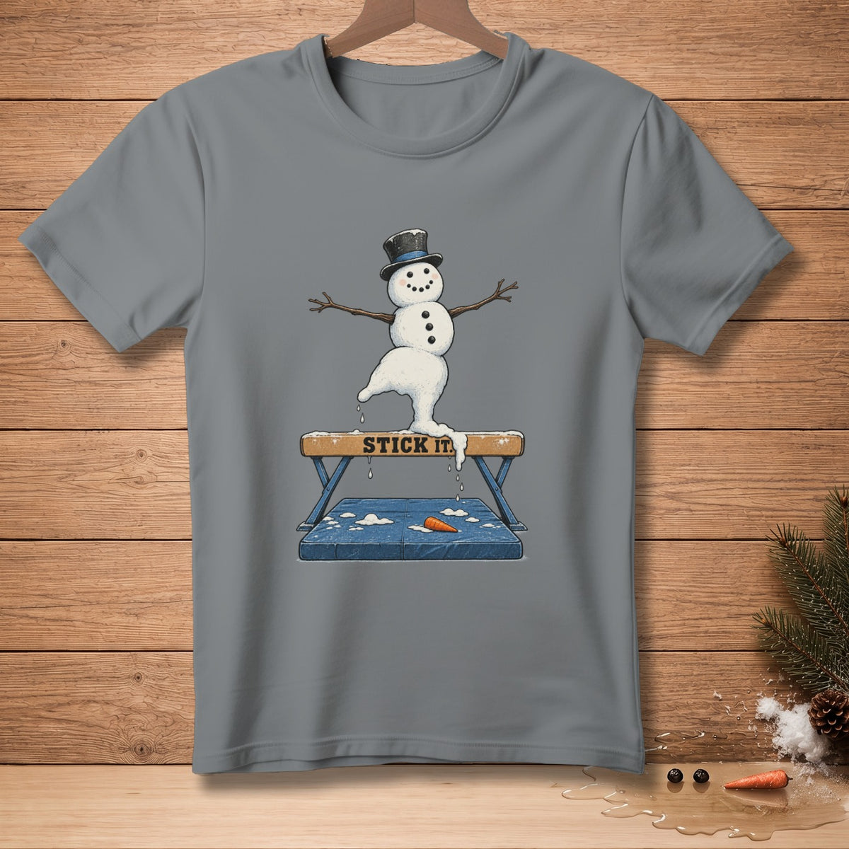 Snowman in top hat performing gymnastics on a balance beam with "STICK IT" text.
