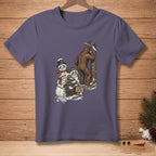 Bigfoot plays hide-and-seek with snowmen on a purple t-shirt.
