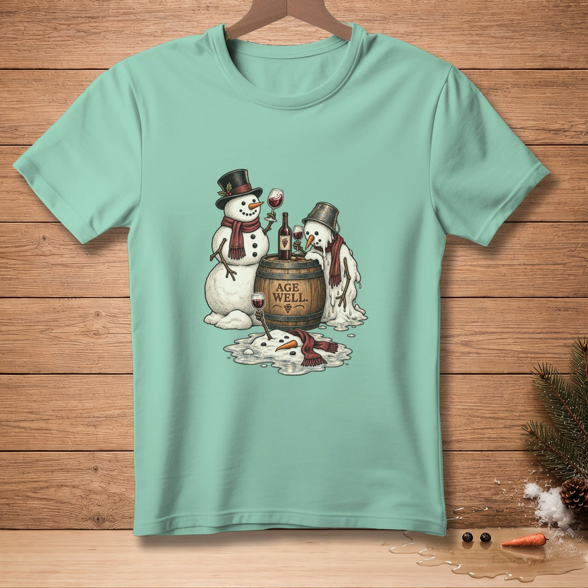 Two snowmen stand by a barrel that reads "Age Well." One is melting.