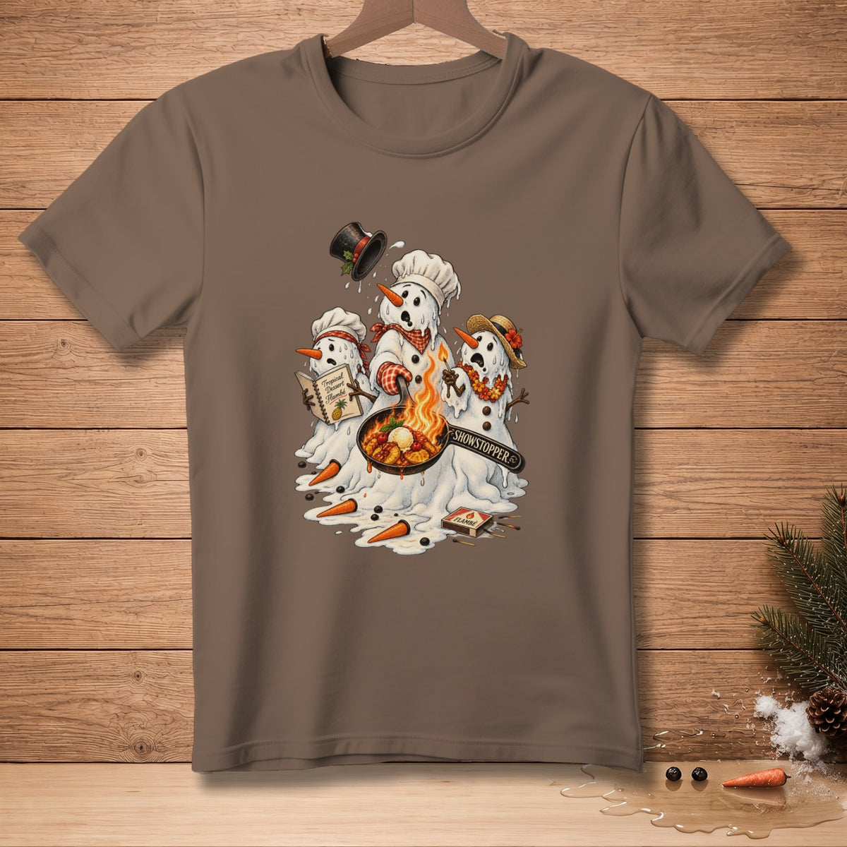 Melting snowmen cooking a flambe with "Showstopper" text on shirt.