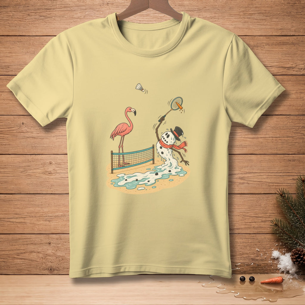 Light yellow t-shirt with a cartoon of a melting snowman playing badminton with a flamingo.