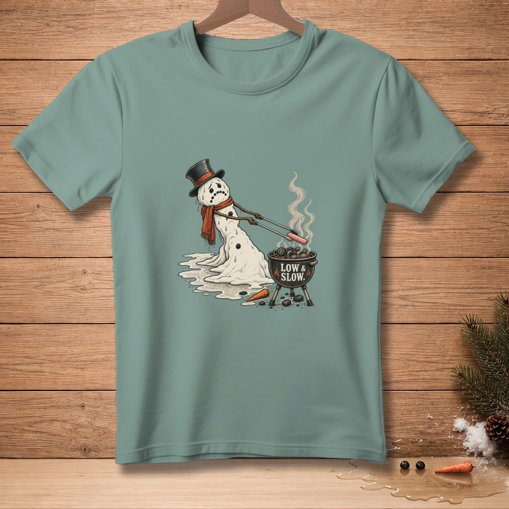 Melting snowman in a top hat grilling hot dogs with text "LOW & SLOW."