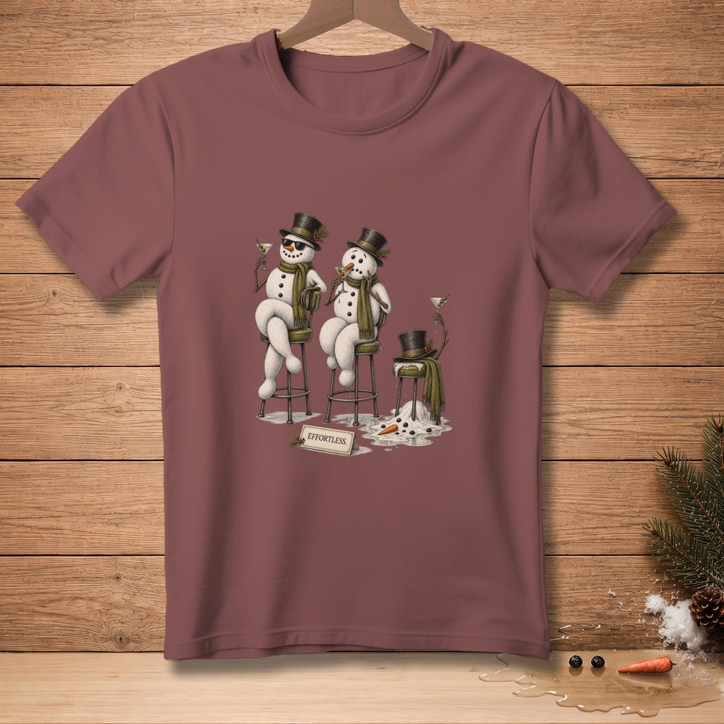 Three snowmen wearing hats and scarves with martinis, one melting, with "EFFORTLESS" sign.