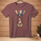 Snowman in hot air balloon basket with "Bucket List" text, flying with burner flame.