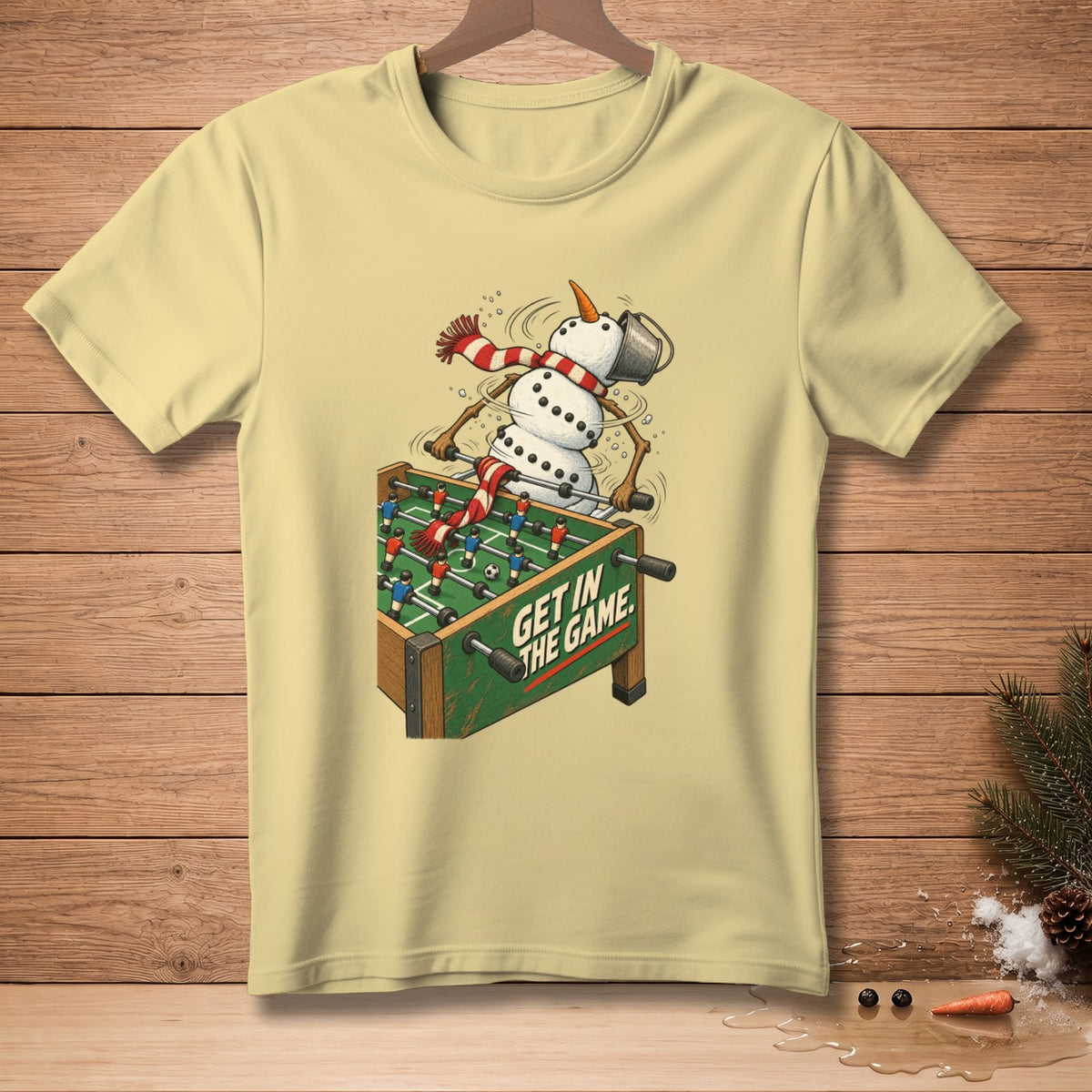 Snowman playing foosball with text "Get In The Game."