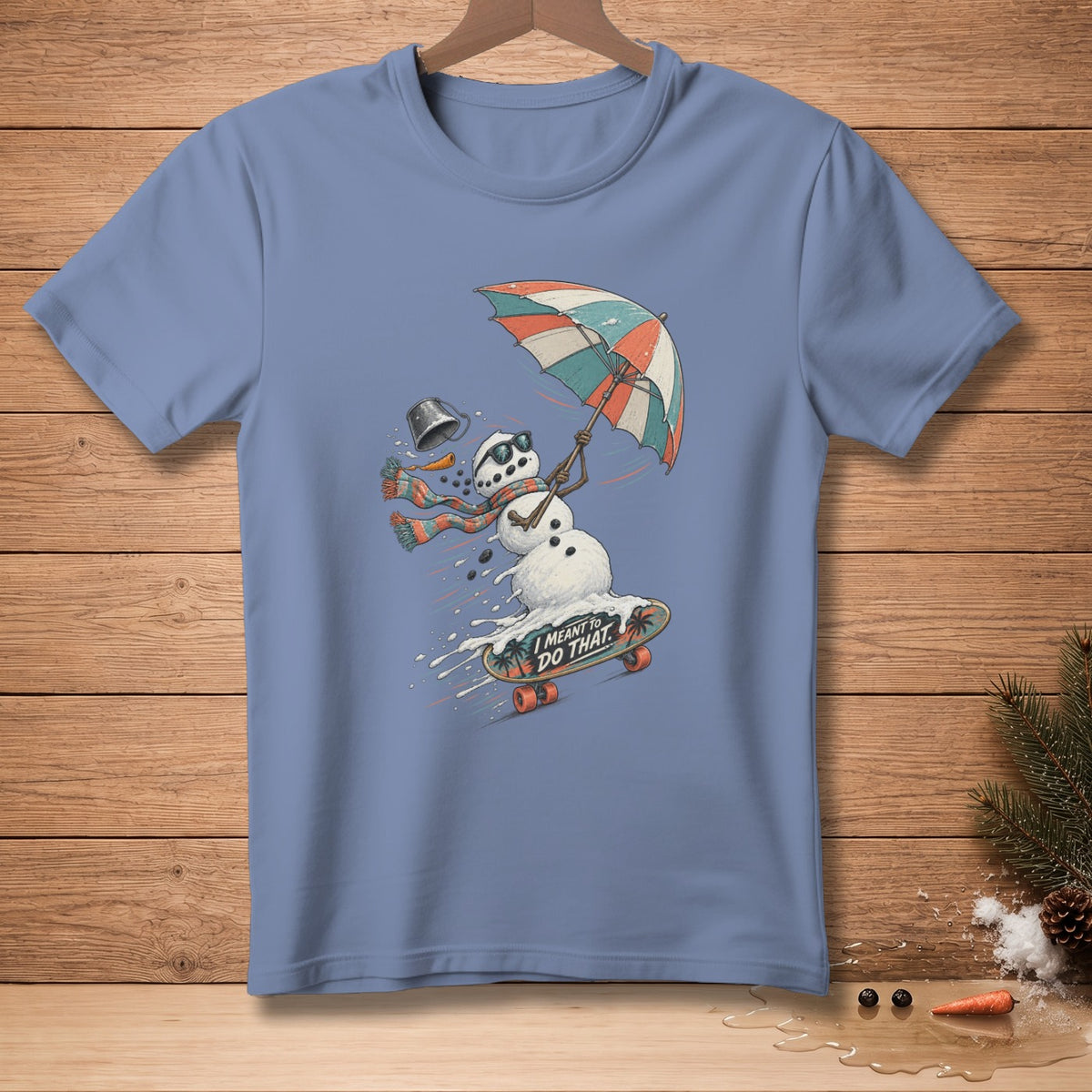 Snowman on skateboard with umbrella and text "I MEANT TO DO THAT."
