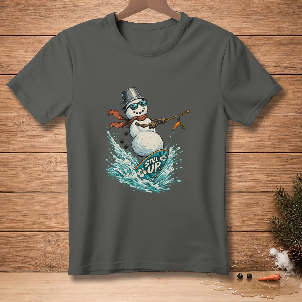 Snowman surfing with carrot on a surfboard that says "Still Up".