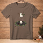 Snowman jumping on trampoline with parts on the ground, on a brown t-shirt.