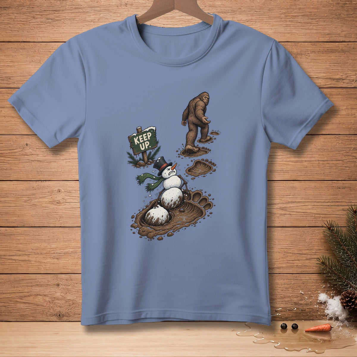 Bigfoot walks past a melting snowman and a "KEEP UP." sign.