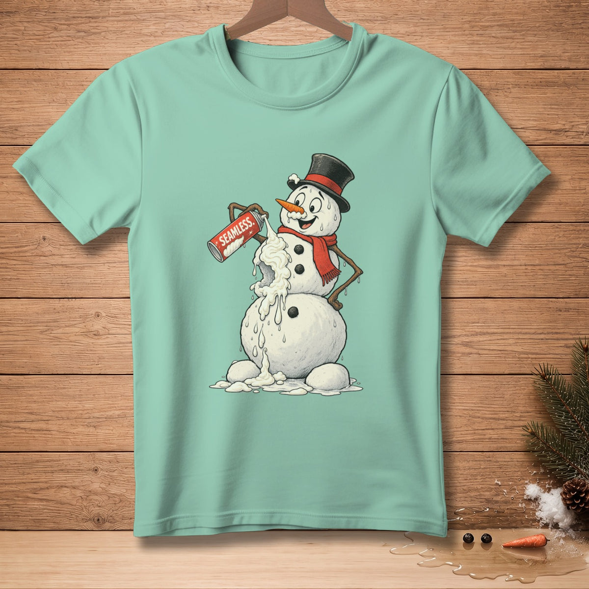 Mint t-shirt with a melting snowman holding a can labeled "SEAMLESS" and spraying whipped cream.