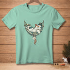 T-shirt with snowmen relaxing in a hammock reading and wearing hats.