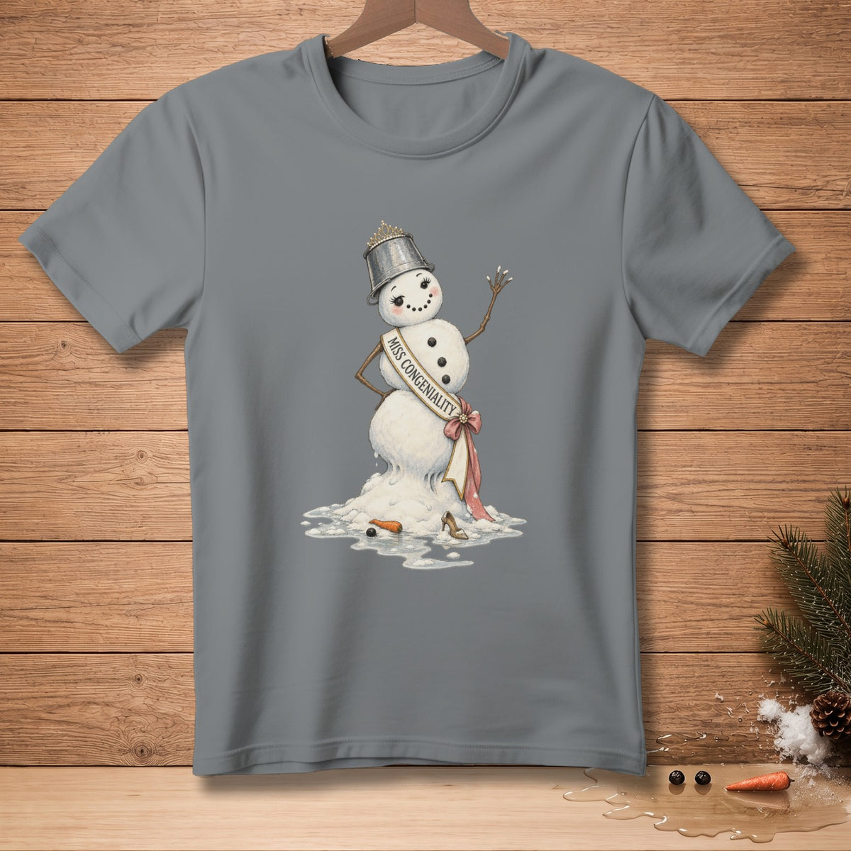 Melting snowman with "Miss Congeniality" sash, wearing a bucket crown and high heel.