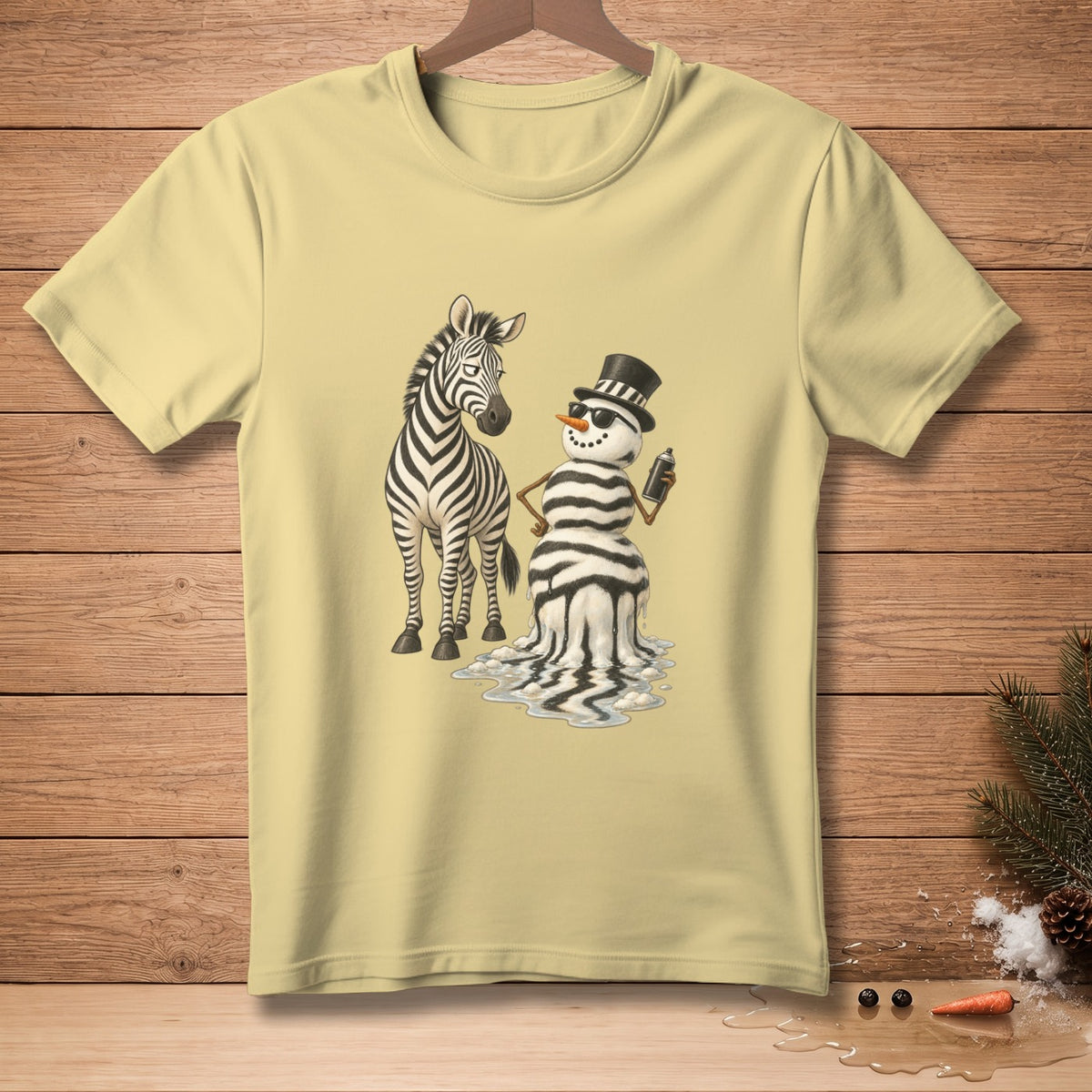 Yellow t-shirt with a zebra and a melting snowman with zebra stripes.