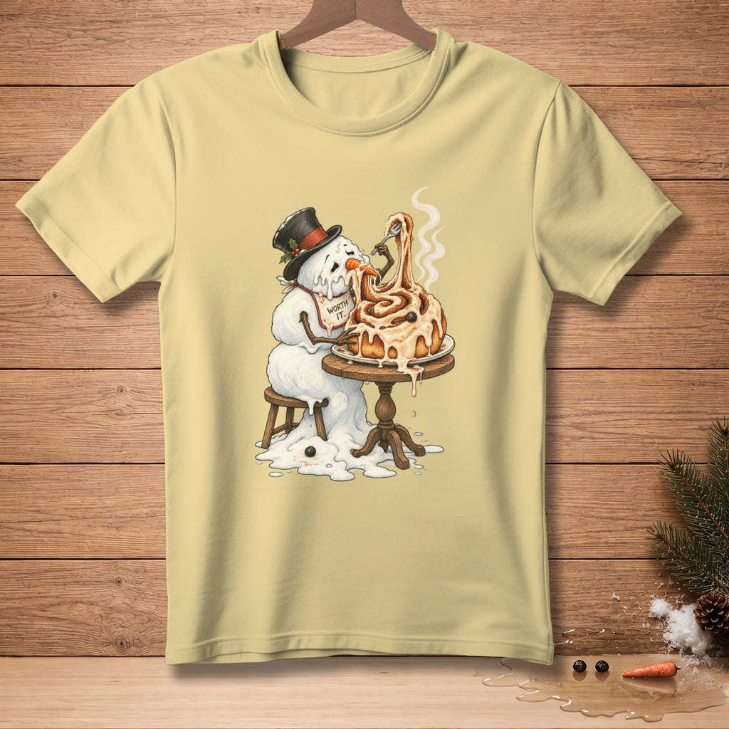 Melting snowman wearing top hat eats cinnamon roll with fork, "Worth It." text on bib.