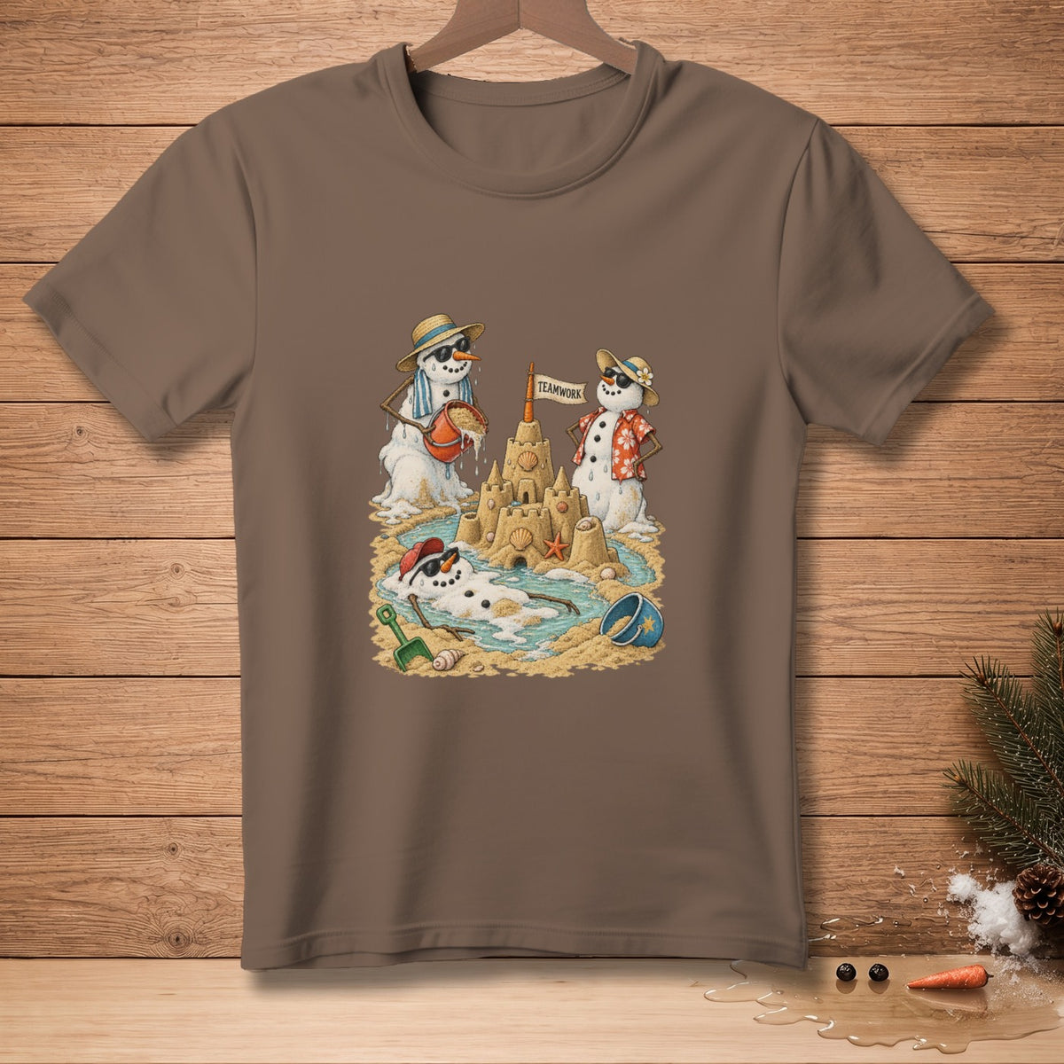 Snowmen building a sandcastle on a beach, one holding a bucket, another wearing a Hawaiian shirt.